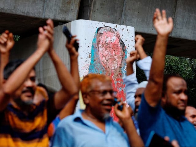 a mural of prime minister sheikh hasina is seen vandalised by protesters as people celebrate her resignation in dhaka bangladesh august 5 2024 photo reuters